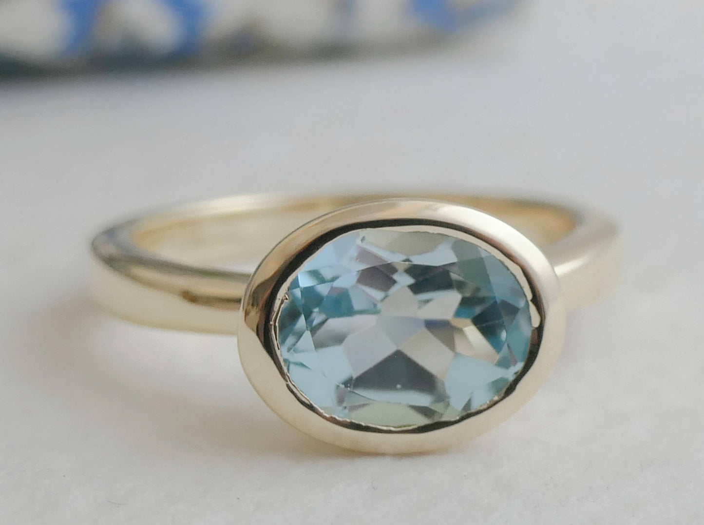 8x10mm Oval Blue Topaz Gold Plated Sterling Silver Ring