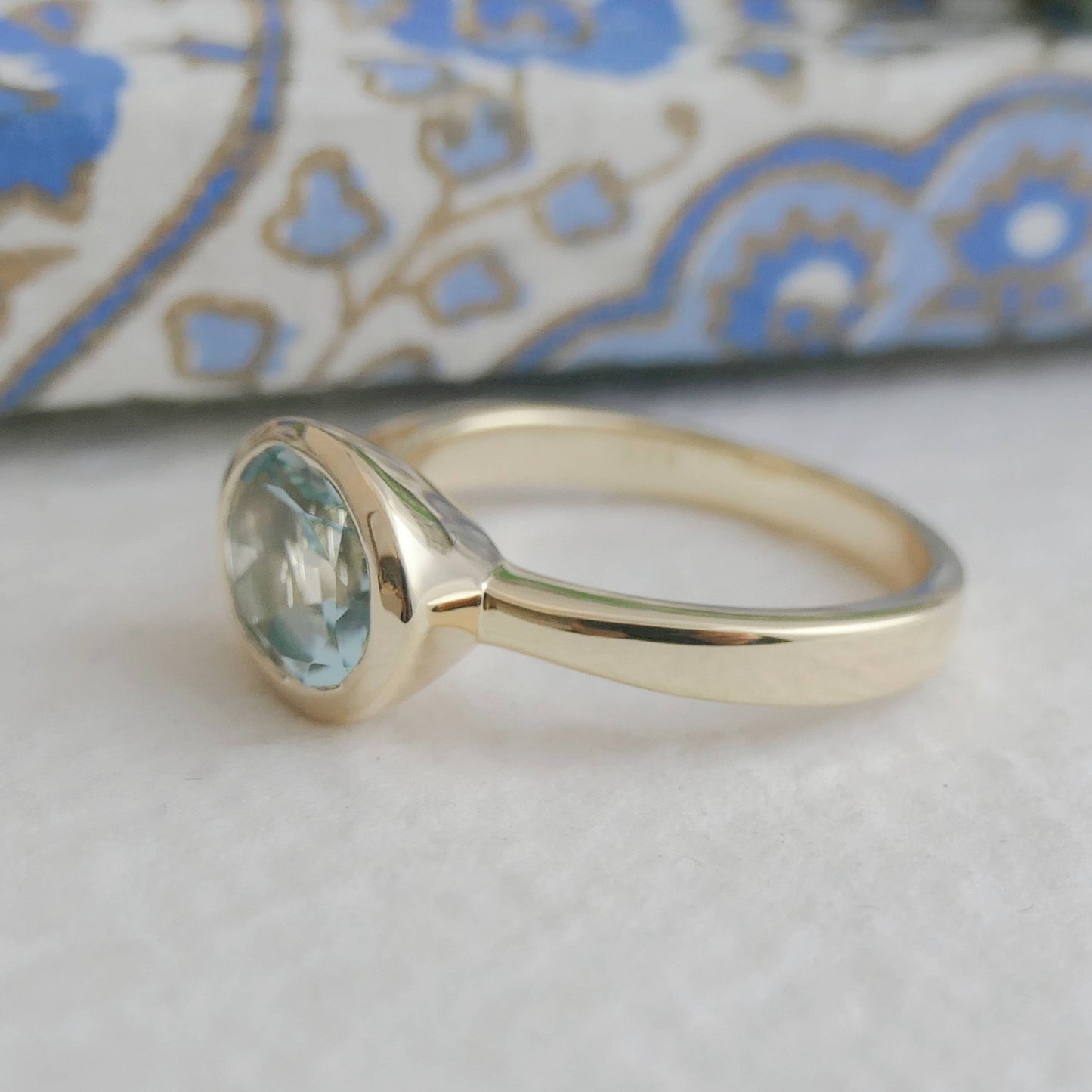 8x10mm Oval Blue Topaz Gold Plated Sterling Silver Ring