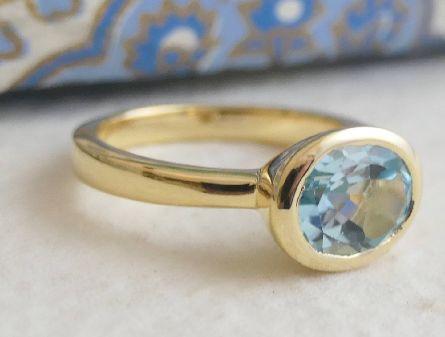 8x10mm Oval Blue Topaz Gold Plated Sterling Silver Ring