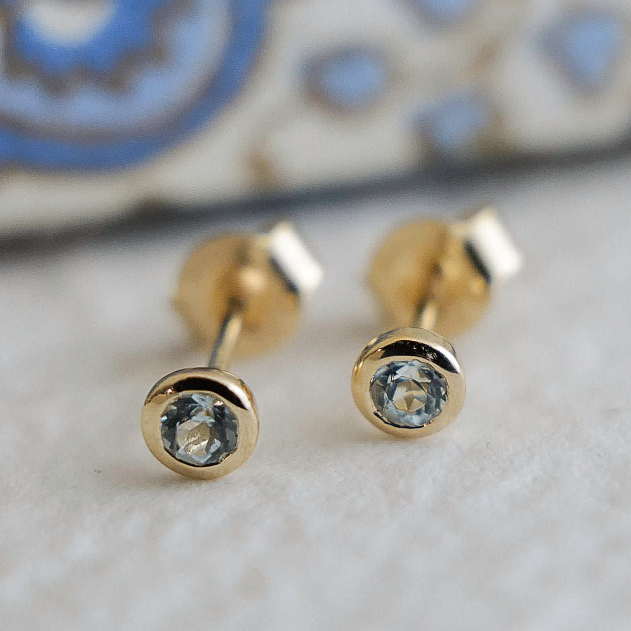 3mm Blue Topaz Gold Plated Sterling Silver Stud Earrings